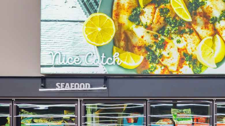 The Aldi seafood freezer with a sign above saying 'nice catch'