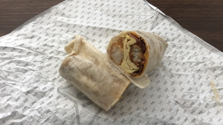 Sonic Ultimate Meat and Cheese breakfast burrito on wrapper