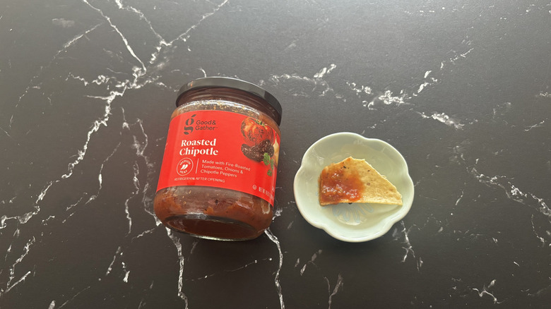 Target Good & Gather roasted chipotle salsa next to chip with salsa on plate