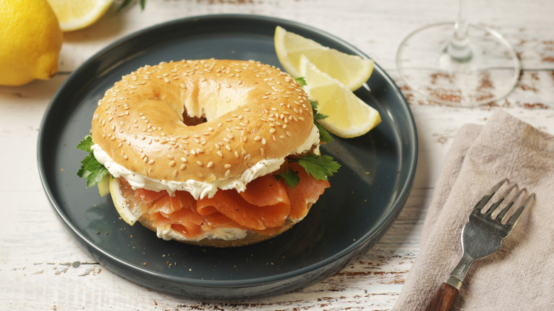 Bagel with lox and schmear on a plate