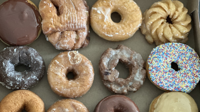 Overhead image of a box of 12 different donuts