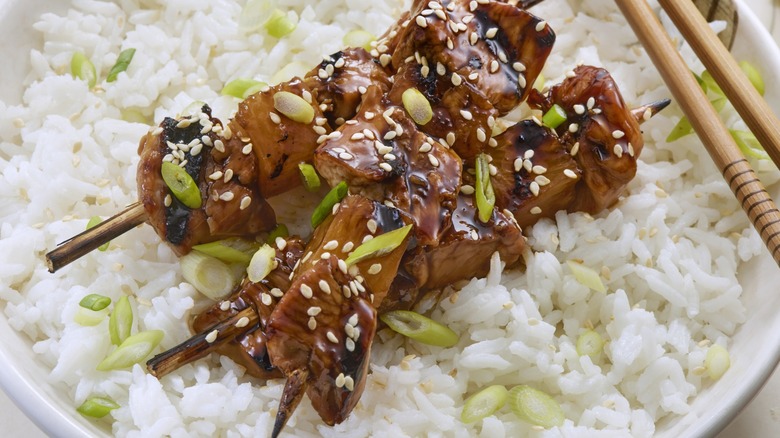 Teriyaki skewers on rice