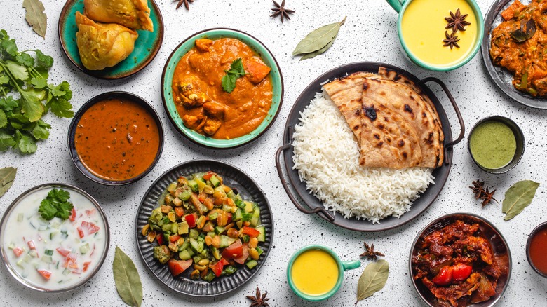 Various Indian curries on table