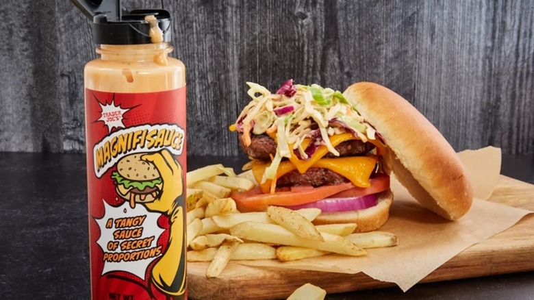 Trader Joe's Magnificsauce with a burger and fries in the background