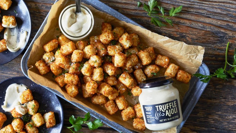 Trader Joe's Truffle Aioli on a pan of tater tots