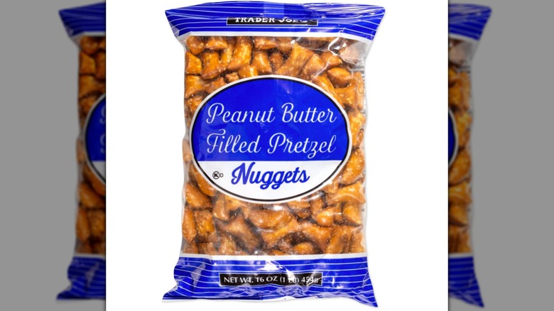 A bag of Trader Joe's Peanut Butter Filled Pretzel Nuggets on a white background