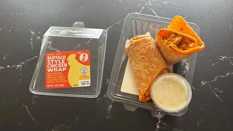 Buffalo Style Chicken Wrap in open container from Trader Joe's on black surface