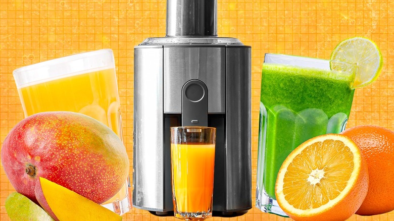 juicer with juices and fruits