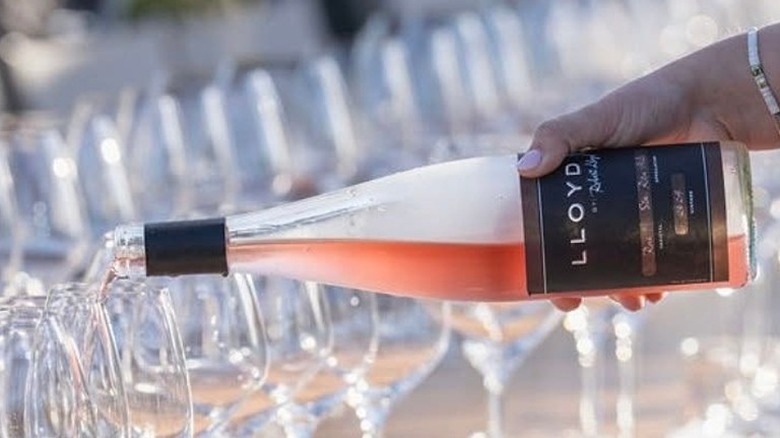 pouring rose wine into glasses