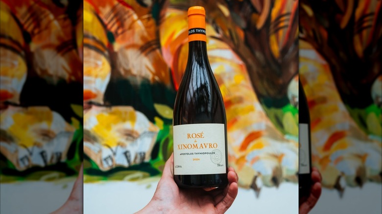 bottle of wine against colorful wall