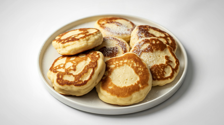 Fluffy pancakes assembled on a white plate
