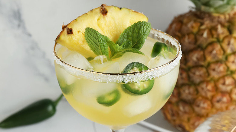 Glass of spicy pineapple and jalapeno margarita