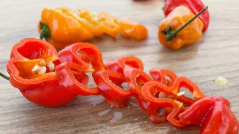 Sliced habanero peppers on a cutting board