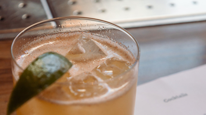 Glass of spicy margarita with cayenne pepper