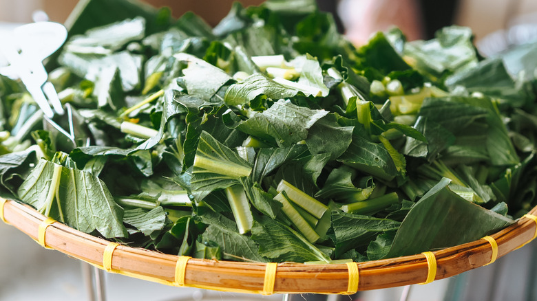 chopped mustard greens in basket