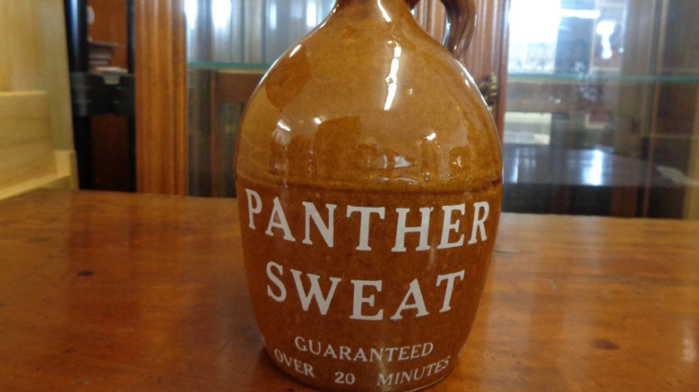 Stoneware jug of panther sweat