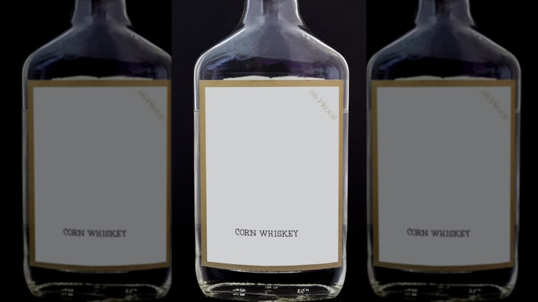 Flask bottle of white lightning liquor corn whiskey