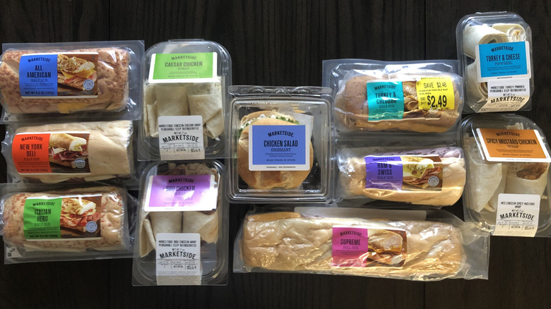 Walmart Marketside sandwiches and wraps laid out on table.