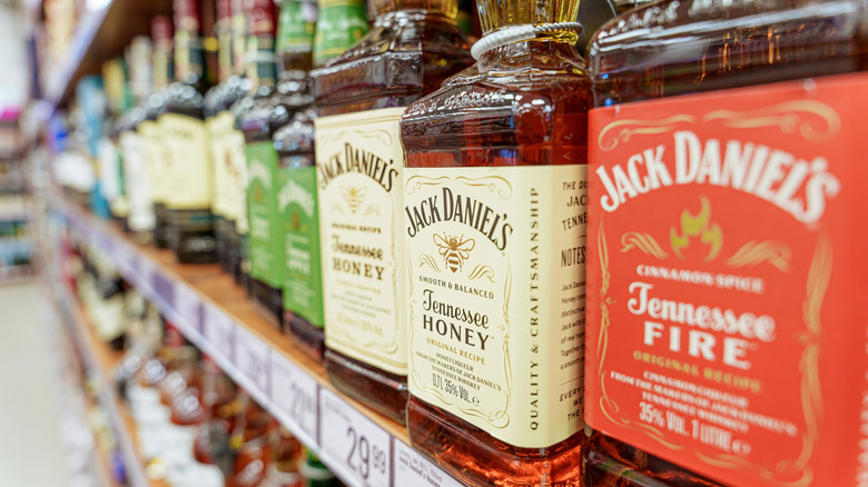 Types of flavored Jack Daniel's whiskey shown on a liquor shelf