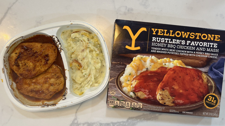 Yellowstone Rustler's Favorite honey BBQ chicken and mash in tray.