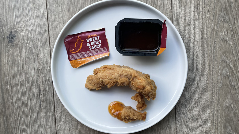 Fried chicken tenders with sweet and spicy sauce on a plate