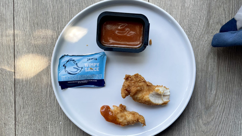Chicken tender pieces with wimpy sauce on a plate