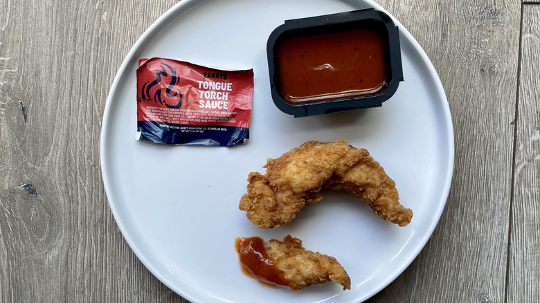 Chicken fingers with Tongue Torch Sauce on a plate