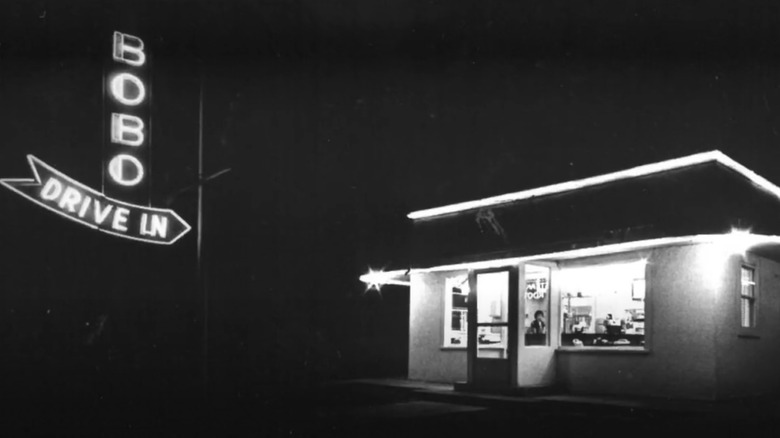 Black and white image of Bobo's Drive-In signage and building