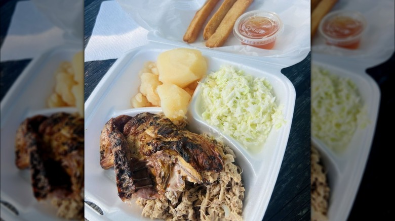 BBQ pork, chicken, slaw, potatoes, and corn sticks in tray