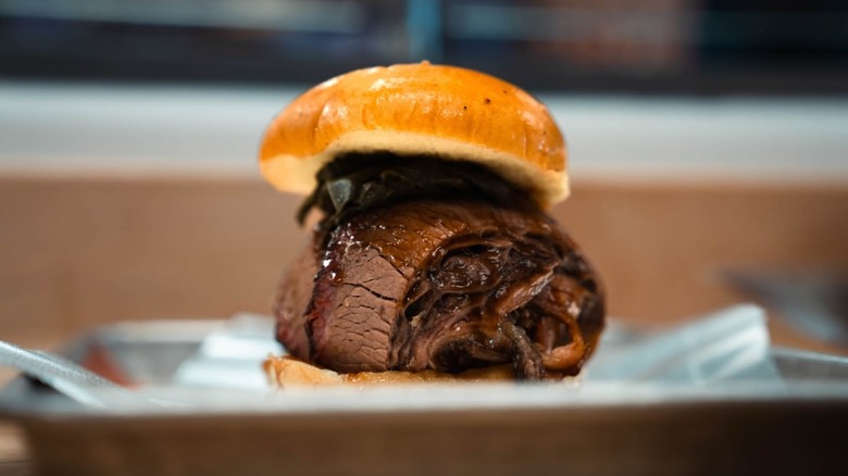 Brisket and pulled pork sandwich on a tray