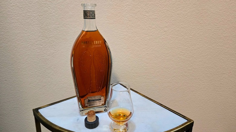 Angel's Envy 10 Year Cask Strength Kentucky straight bourbon with a glass