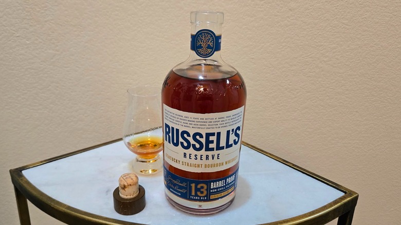 Russell's Reserve 13 year old opened bottle and glass filled with whiskey