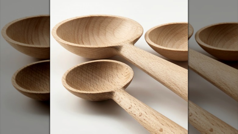 Three wooden measuring spoons of different sizes