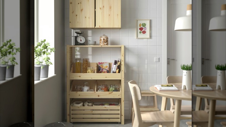 Kitchen with a wooden pantry shelving unit