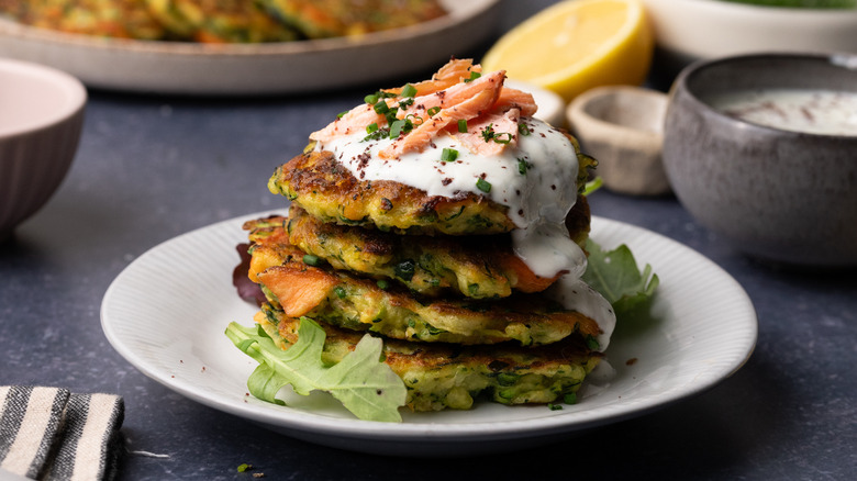stack of fritters with sauce