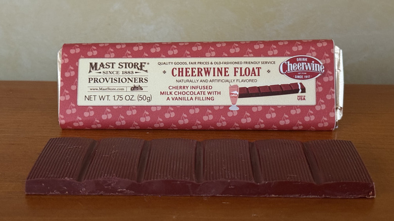 Cheerwine float chocolate bar in front of wrapper on wooden table