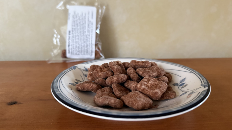 Maple French toast bites on plate in front of bag