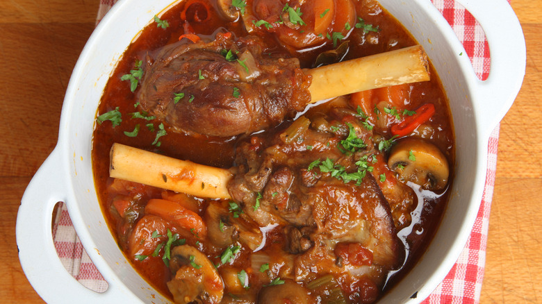 Braised lamb shanks in a casserole dish