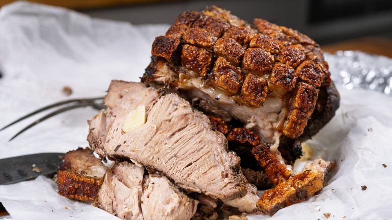 A cooked pork roast with crispy crackling