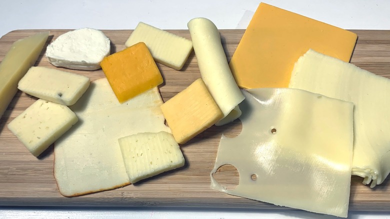 cutting board with cheeses