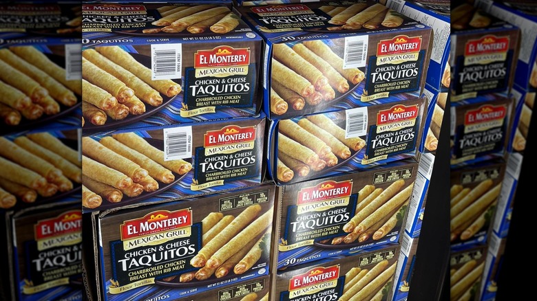 Boxes of El Monterey Mexican Grill Chicken and Cheese Taquitos on display at Costco