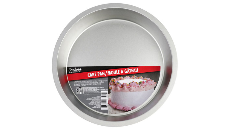 Round silver cake tin with paper label