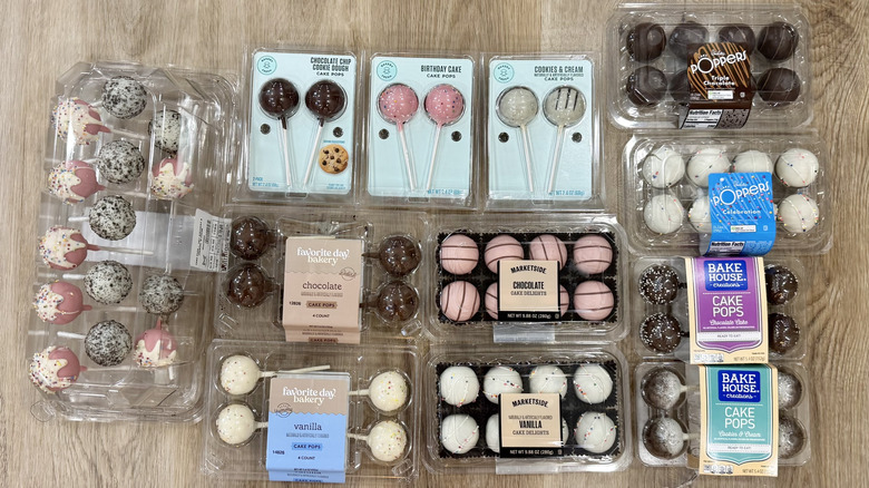 13 different kinds of grocery store cake pops in packaging.