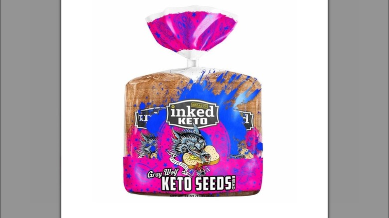 Two loaves of Inked Keto Gray Wolf Keto Seeds Bread in plastic sleeve on white background