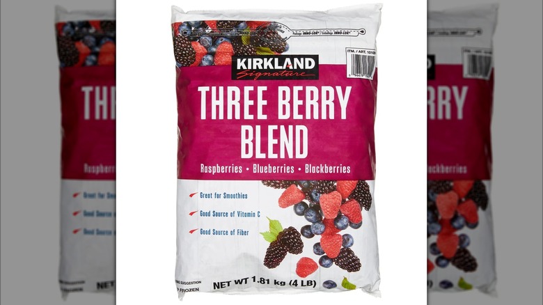 Bag of Kirkland Signature Three Berry Blend frozen fruit on white background
