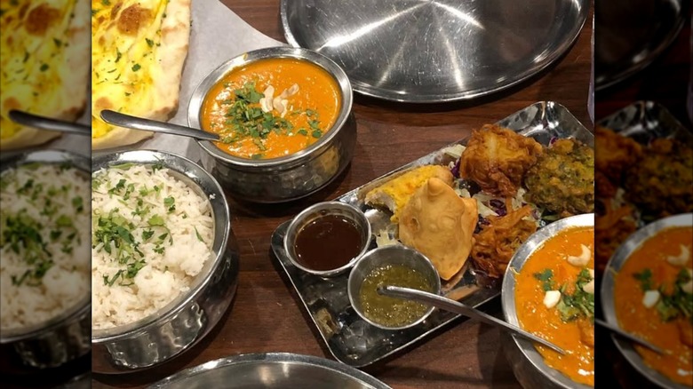 Indian food spread on wooden table