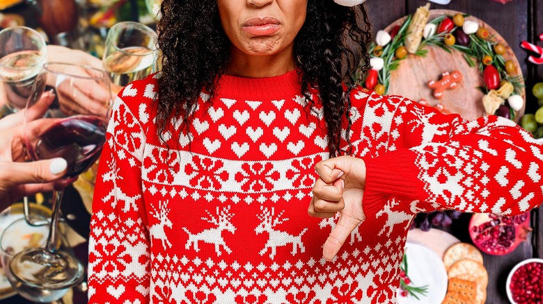 woman in Christmas sweater giving thumbs down