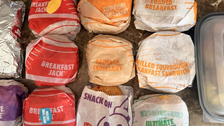 overhead shot of wrapped breakfast sandwiches and breakfast platter from Jack in the Box