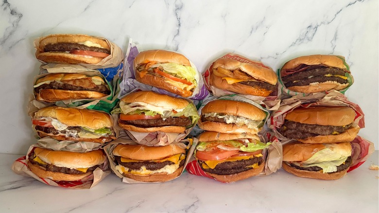 13 burgers from Jack in the Box on marble background