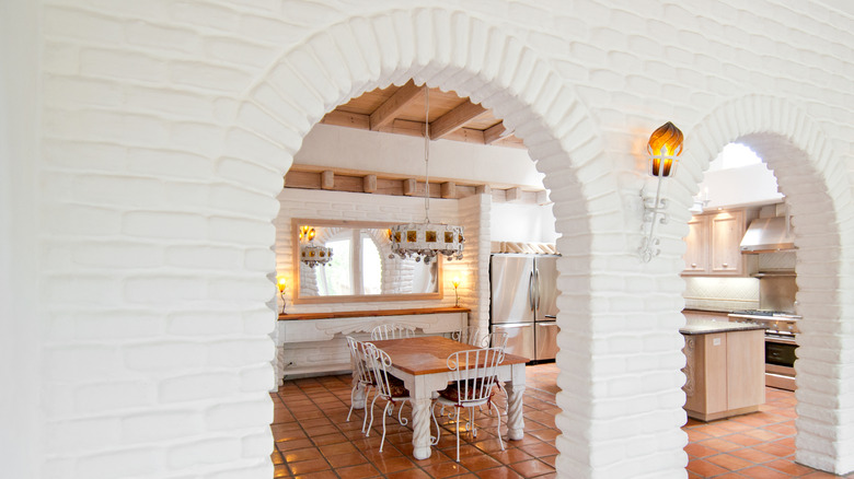 Arched entrance to a large kitchen
